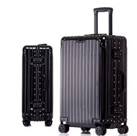 Two black suitcases with a ribbed design on a white background