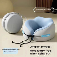 Compact travel neck pillow with carrying case on a beige surface