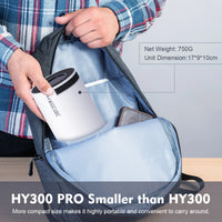 Person holding a white mug with black lid inside a blue backpack, with text about product dimensions and weight.