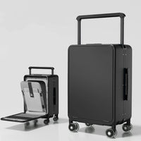 Black suitcase with a smaller black suitcase on wheels inside it, on a light gray background