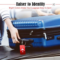 Blue suitcase with a red tag held by a person, with text about bright colors making luggage easy to spot.
