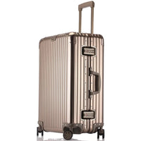 Gold suitcase with wheels and handle on a white background