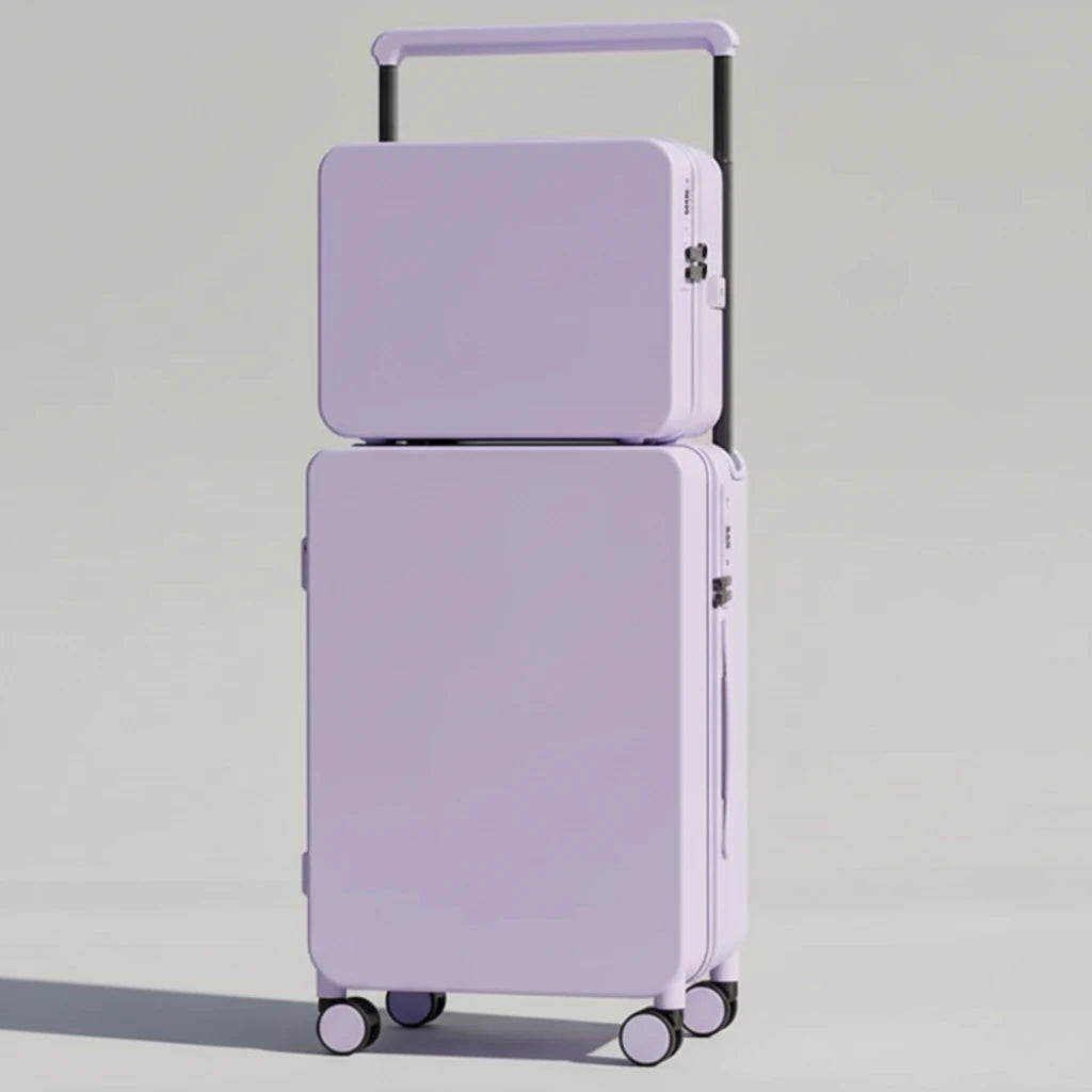 Set of two purple suitcases on a wooden floor with a neutral background