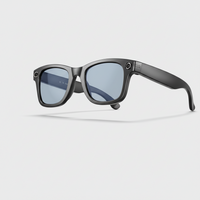 Sunglasses with a gray frame and blue lenses on a light gray background