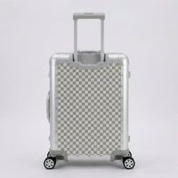 Rear view of Aeria Prestige The Monarch aluminum travel case in Alabaster White Damier checkered finish, displaying the retractable handle and smooth-rolling spinner wheels.