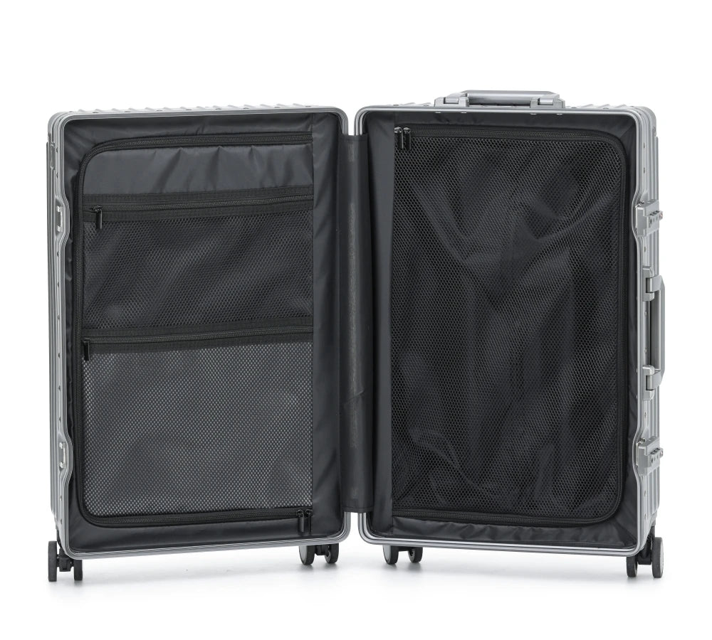 Full-length interior view of The Aero-PC Vanguard, showcasing the high-resilience organizational system. The suitcase is open to reveal dual high-density mesh compression panels and integrated zippered storage pockets, designed to secure packed items and maximize space efficiency for the agile traveler.