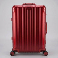 Front view of The Masterpiece Legacy aluminum luggage by AERIA PRESTIGE in Imperial Red, featuring a premium zipperless aerospace-grade alloy hardshell and silent multi-directional spinner wheels.
