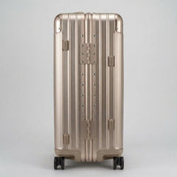 Side view of The Masterpiece Legacy aluminum luggage by AERIA PRESTIGE in Rose Champagne, highlighting the heavy-duty zipperless frame, reinforced hinges, and durable aerospace-grade alloy construction.