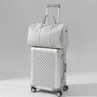The Monarch 24-inch medium aluminum suitcase set in Arctic Silver, curated by AERIA Prestige with zipperless TSA locks and aerospace-grade alloy shell.