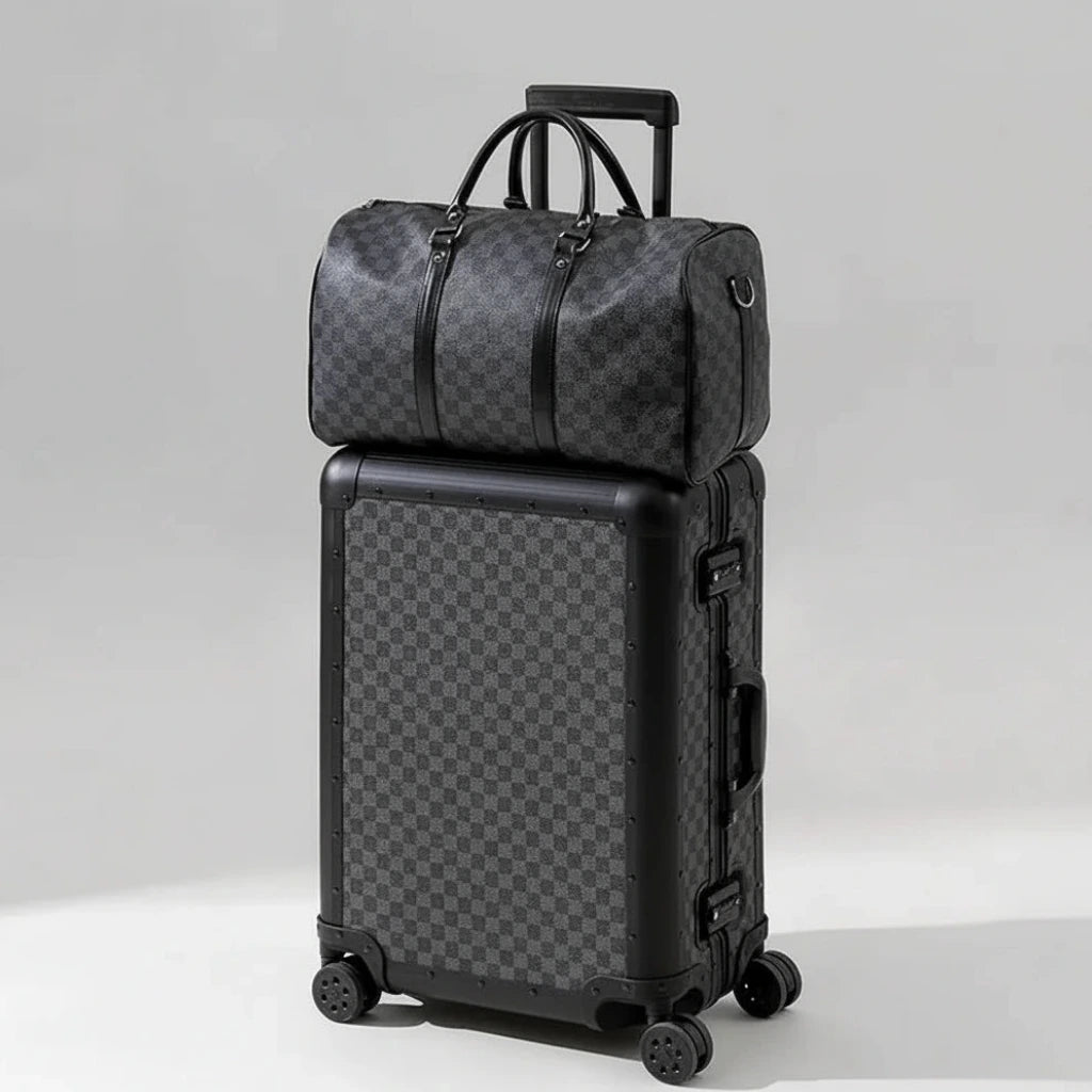 The Monarch premium aluminum luggage set in Midnight Onyx, featuring a zipperless interlocking frame, curated and certified by AERIA Prestige.
