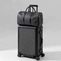 The Monarch premium aluminum luggage set in Midnight Onyx, featuring a zipperless interlocking frame, curated and certified by AERIA Prestige.