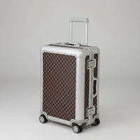 Checkered pattern suitcase on a light background
