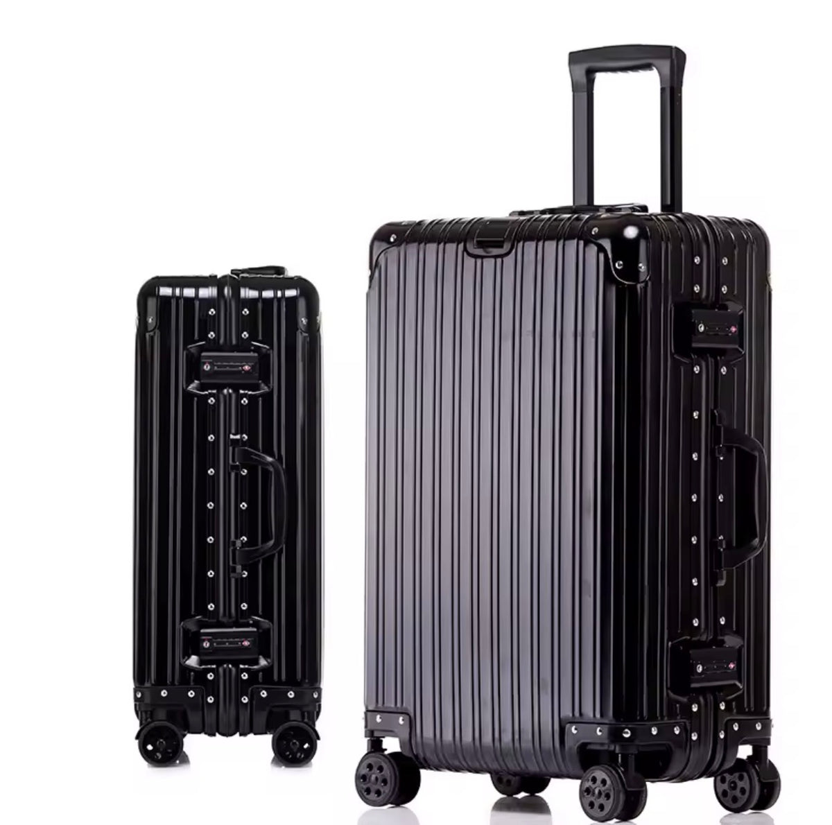 Two black suitcases with a ribbed design on a white background