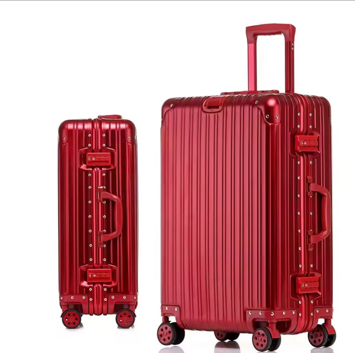 Two red suitcases with wheels on a white background