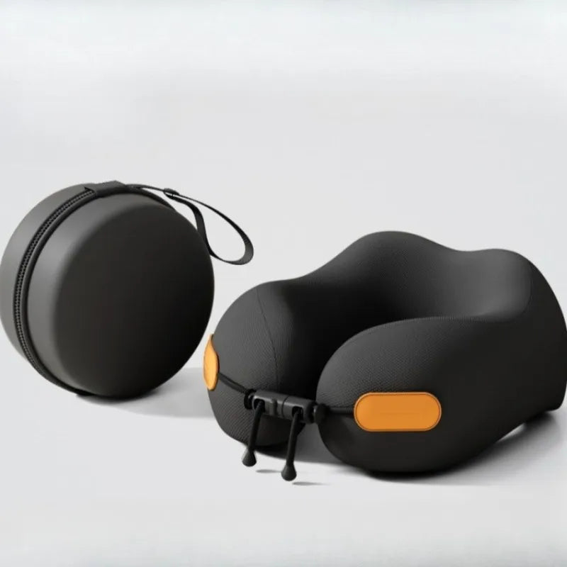 Black travel neck pillow with orange accents and carrying case on a light gray background
