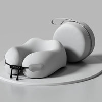 White travel neck pillow with carrying case on a gray background