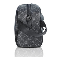Gray patterned bag with a black strap on a white background