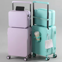 Two stacked suitcases, one purple and one teal, with accessories on a light wooden floor.
