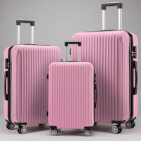 Aeria Prestige The Vantage 3-piece pink hardshell spinner luggage set with extended telescoping handles, sizes 20, 24, and 28 inch.