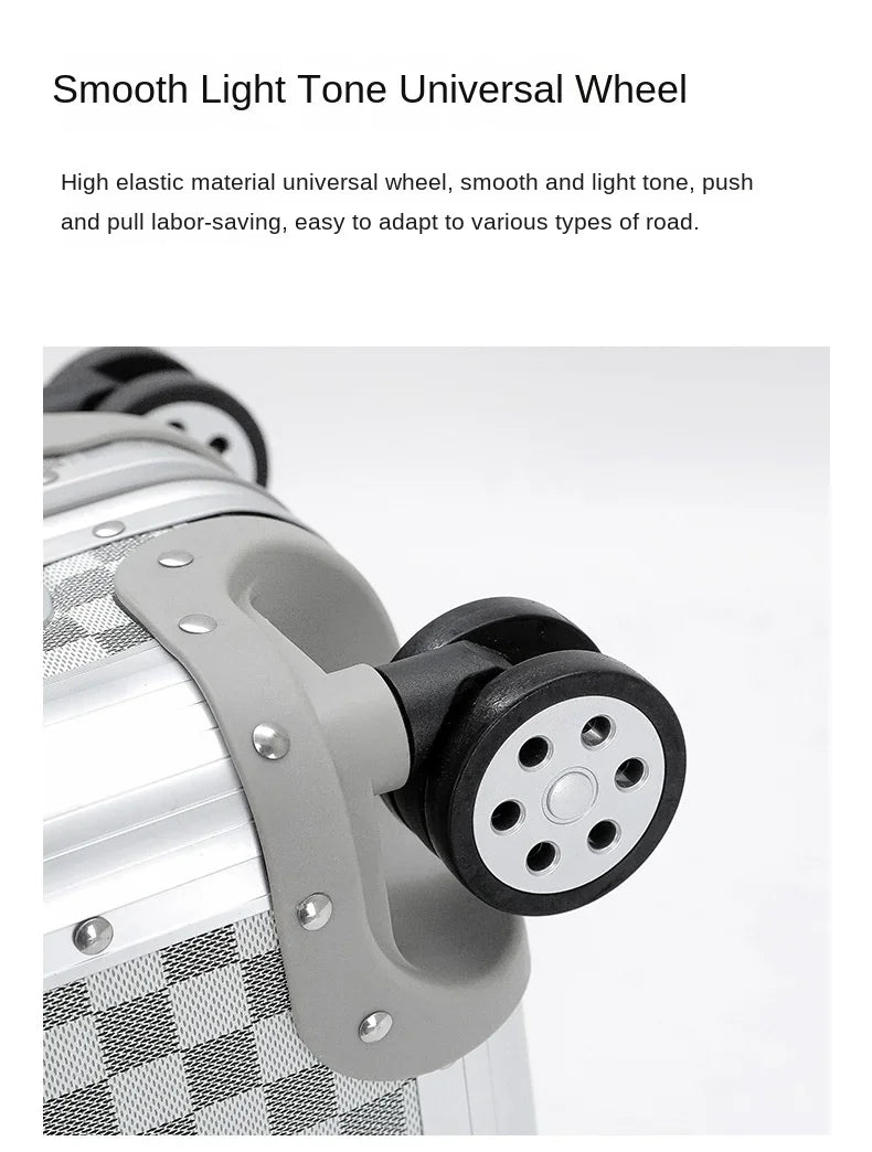 Close-up of the high-elasticity silent-motion spinner wheel with shock-absorbing TPE treads on the Monarch aluminum luggage.
