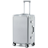 Full-length side view of The Aero-PC Vanguard — Carbon-Texture Frame Case in the polished Palladium Silver finish. This high-resilience travel case by AERIA PRESTIGE features a multi-layered PC-Matrix shell, a heavy-duty Aero-Aluminum zipperless frame, and integrated dual-latch TSA security locks for rapid, secure access.