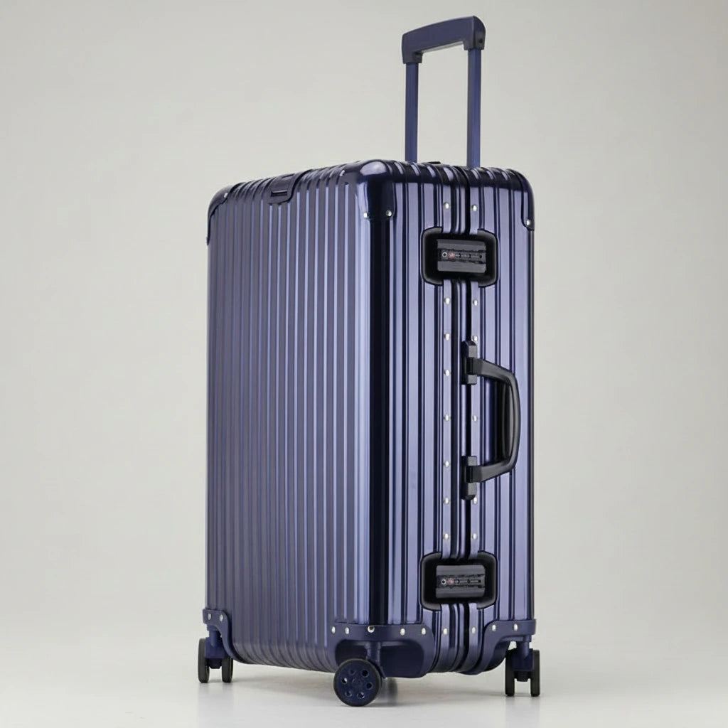 Full-length side view of The Masterpiece — The Legacy Aluminum Luggage in the Deep Azure finish. As part of the AERIA PRESTIGE Titan Series, this luxury travel case features an aerospace-grade aluminum-magnesium alloy chassis, silent multi-directional wheels, and integrated TSA-approved locks, offering a calm and professional aesthetic for elite travelers