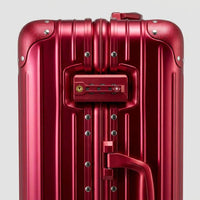 Close-up of the integrated dual TSA-approved combination locks on The Masterpiece Legacy aluminum luggage by AERIA PRESTIGE in Imperial Red, showcasing bank-grade security and precision engineering.